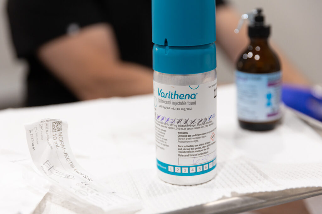 A container of Varithena treatment microfoam sits on a treatment tray, about to be used for treatment by a vein specialist in Lakewood Ranch.