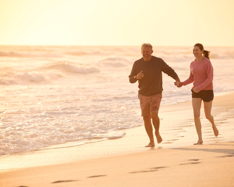 Mature retired couple enjoying time on the Florida Lakes beaches in their shorts because they're happy with how their legs look after sclerotherapy in Bradenton, FL